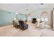 Living room with vaulted ceiling, neutral decor, and large windows at 18606 N Iona Ct, Sun City West, AZ 85375