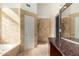 Bathroom with walk-in shower and granite vanity at 19037 N 73Rd Ln, Glendale, AZ 85308