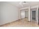 Spacious bedroom with mirrored closet and tile floors at 19037 N 73Rd Ln, Glendale, AZ 85308