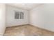 Well-lit bedroom featuring tile flooring and a ceiling fan at 19037 N 73Rd Ln, Glendale, AZ 85308