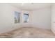 Bedroom with large windows and tile floors at 19037 N 73Rd Ln, Glendale, AZ 85308