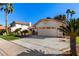 View of the home's exterior, including the driveway and landscaping at 19037 N 73Rd Ln, Glendale, AZ 85308