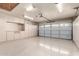 Garage with built-in storage and epoxy flooring at 19037 N 73Rd Ln, Glendale, AZ 85308