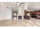 Living room with a fireplace, and views of the kitchen and backyard at 19037 N 73Rd Ln, Glendale, AZ 85308