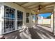 Covered patio with ceiling fan and access to backyard at 19037 N 73Rd Ln, Glendale, AZ 85308