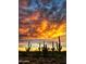 Dramatic sunset over the Sonoran Desert with saguaro cacti at 19320 W Missouri Ave, Litchfield Park, AZ 85340