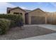 House exterior with two car garage at 20249 W Woodlands Ave, Buckeye, AZ 85326