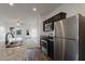 Modern kitchen with stainless steel appliances and granite countertops at 20249 W Woodlands Ave, Buckeye, AZ 85326