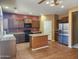 Kitchen with stainless steel appliances and island at 20356 N 261St Dr, Buckeye, AZ 85396