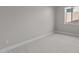 Neutral bedroom featuring carpet flooring, baseboards, and a bright window at 21537 W Pierson St, Buckeye, AZ 85396