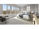 Bright bedroom with large windows, a neutral palette, and a plush queen-size bed at 21537 W Pierson St, Buckeye, AZ 85396
