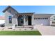 Charming single-Gathering home with a welcoming front porch and a two-car garage at 21537 W Pierson St, Buckeye, AZ 85396