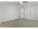 Bright bedroom features neutral carpet, ceiling fan, and closet at 2171 S Portland Ave, Gilbert, AZ 85295