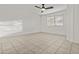 Bedroom featuring tile flooring and a ceiling fan at 2171 S Portland Ave, Gilbert, AZ 85295