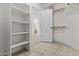 View of a walk-in closet with open shelving at 2171 S Portland Ave, Gilbert, AZ 85295