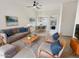 Living room with modern furniture, a gray sofa, and lots of natural light at 2171 S Portland Ave, Gilbert, AZ 85295