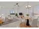 Living room with stylish furniture, a ceiling fan, and plenty of natural light at 2171 S Portland Ave, Gilbert, AZ 85295