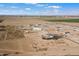 Aerial view of a new housing development with multiple houses under construction at 23527 W Estes Way, Buckeye, AZ 85326