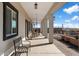 Covered patio with seating area, fire pit, and mountain views at 23527 W Estes Way, Buckeye, AZ 85326