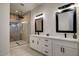 Elegant bathroom with double vanity, large shower, and modern fixtures at 23527 W Estes Way, Buckeye, AZ 85326