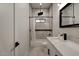 Modern bathroom with white quartz countertops and a bathtub at 23527 W Estes Way, Buckeye, AZ 85326