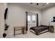 Cozy bedroom with a desk and large window offering natural light at 23527 W Estes Way, Buckeye, AZ 85326