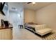 Relaxing bedroom featuring a comfortable bed and a built-in sofa at 23527 W Estes Way, Buckeye, AZ 85326