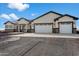 Two-story house with a three-car garage and stone accents at 23527 W Estes Way, Buckeye, AZ 85326