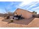 Backyard view showing patio, grill, and additional seating at 23802 W Tamarisk Ave, Buckeye, AZ 85326