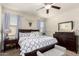 Bright bedroom featuring a king-size bed and ample storage at 23802 W Tamarisk Ave, Buckeye, AZ 85326