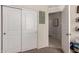 White closet with double doors and access to hallway at 23802 W Tamarisk Ave, Buckeye, AZ 85326