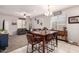 Dining area with a wooden table and leather chairs at 23802 W Tamarisk Ave, Buckeye, AZ 85326