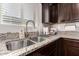 Kitchen sink and countertop detail with stainless steel sink at 23802 W Tamarisk Ave, Buckeye, AZ 85326