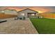 Artificial turf backyard with firepit and patio at 2562 N Abbey Rd, Casa Grande, AZ 85122