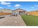 Backyard with patio, artificial turf, fire pit, and playset at 2562 N Abbey Rd, Casa Grande, AZ 85122