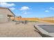 Backyard with firepit, patio, and trampoline at 2562 N Abbey Rd, Casa Grande, AZ 85122