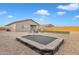 Backyard with trampoline and gravel landscaping at 2562 N Abbey Rd, Casa Grande, AZ 85122