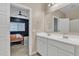 Bathroom with double vanity and view into bedroom at 2562 N Abbey Rd, Casa Grande, AZ 85122