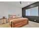 Bedroom with orange bedding and dark accent wall at 2562 N Abbey Rd, Casa Grande, AZ 85122