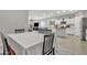 Bright dining area with table and chairs, view of kitchen at 2562 N Abbey Rd, Casa Grande, AZ 85122