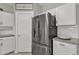 Stainless steel appliances and white shaker cabinets in kitchen at 2562 N Abbey Rd, Casa Grande, AZ 85122