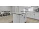 Kitchen island with granite countertop and white cabinets at 2562 N Abbey Rd, Casa Grande, AZ 85122