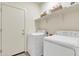 Laundry room with washer, dryer, and shelving at 2562 N Abbey Rd, Casa Grande, AZ 85122