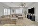 Living area featuring sectional sofa and ceiling fan at 2562 N Abbey Rd, Casa Grande, AZ 85122