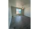 Large bedroom with ceiling fan and grey wood-look flooring at 25835 W Denver Hills Dr, Wittmann, AZ 85361