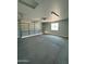 Large garage with an open garage door and a concrete floor at 25835 W Denver Hills Dr, Wittmann, AZ 85361