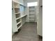 Large walk-in closet with ample shelving and hanging space at 25835 W Denver Hills Dr, Wittmann, AZ 85361