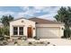 Single-story home with Spanish-style tile roof and desert landscaping at 26096 S 228Th Pl, Queen Creek, AZ 85142