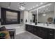 Bathroom with double vanity, a large soaking tub, and a modern chandelier at 26698 N 104Th Way, Scottsdale, AZ 85262