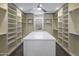 Bright and spacious walk-in closet with ample shelving and storage at 26698 N 104Th Way, Scottsdale, AZ 85262